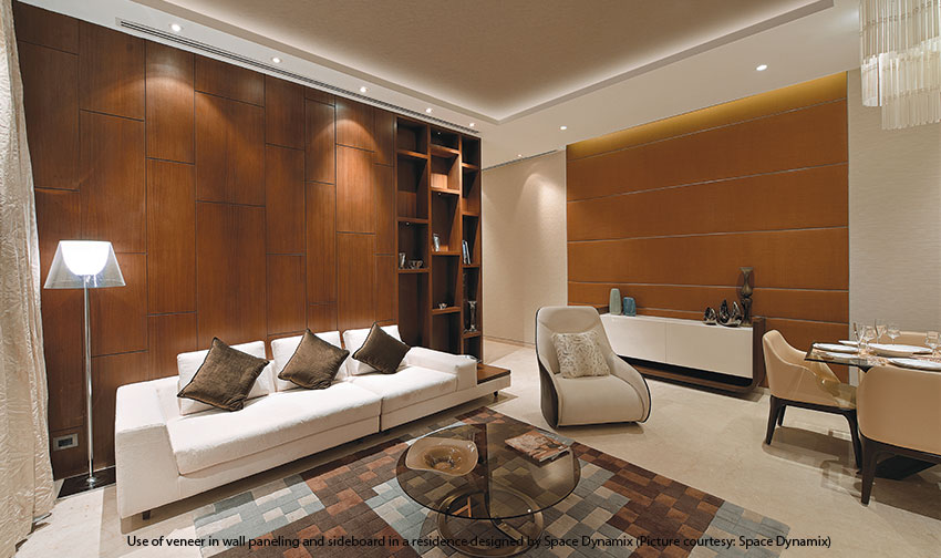 Elegant living room with wood veneer wall paneling and sideboard